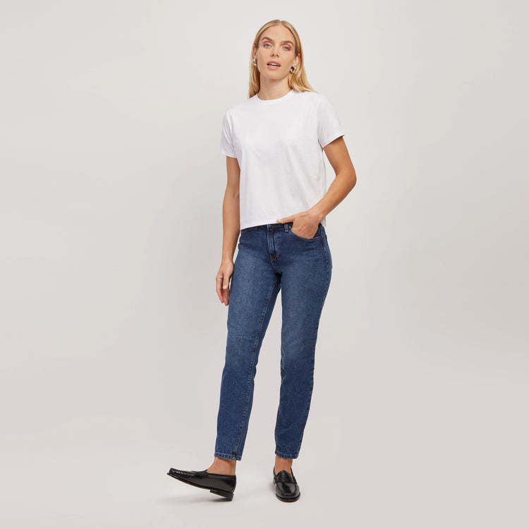 Women wearing Light/Medium Blue High Rise Mom Oliver Jeans
