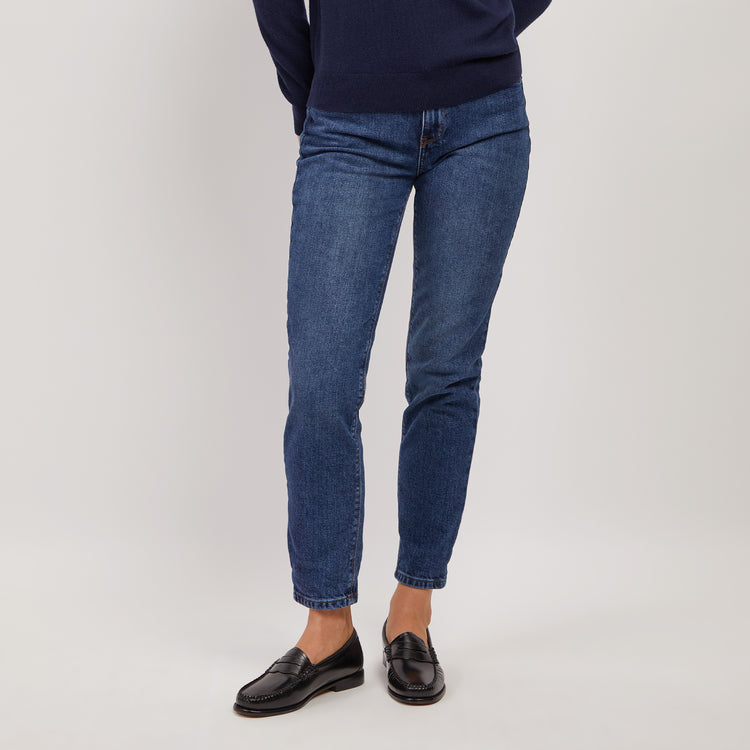Women wearing Light/Medium Blue High Rise Mom Oliver Jeans