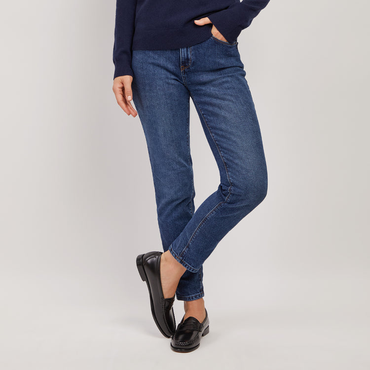 Women wearing Light/Medium Blue High Rise Mom Oliver Jeans