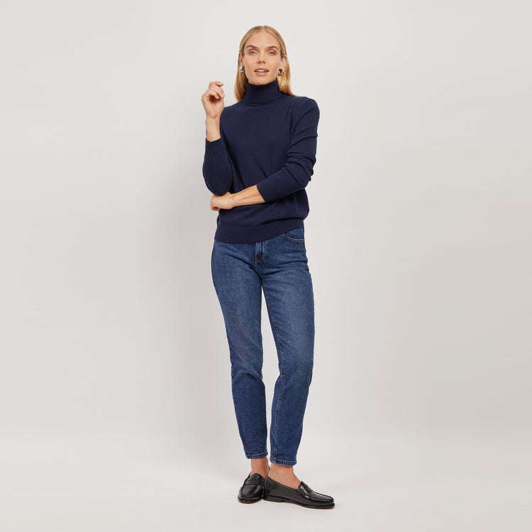 Women wearing Light/Medium Blue High Rise Mom Oliver Jeans