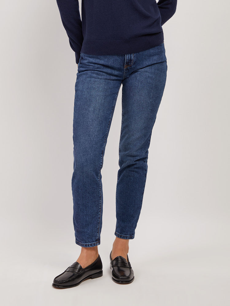 Women wearing Light/Medium Blue High Rise Mom Oliver Jeans