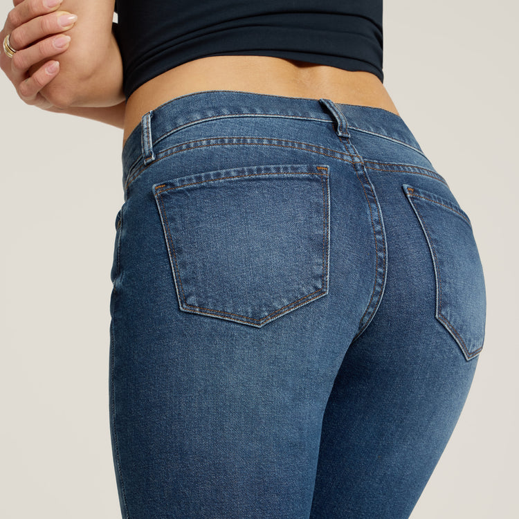 Women wearing Medium Blue Mid Rise Slim Straight Ridge Jeans
