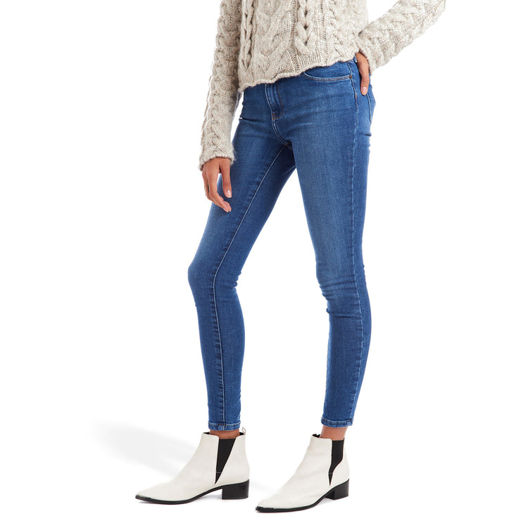 Women wearing Light/Medium Blue High Rise Skinny Beekman Jeans