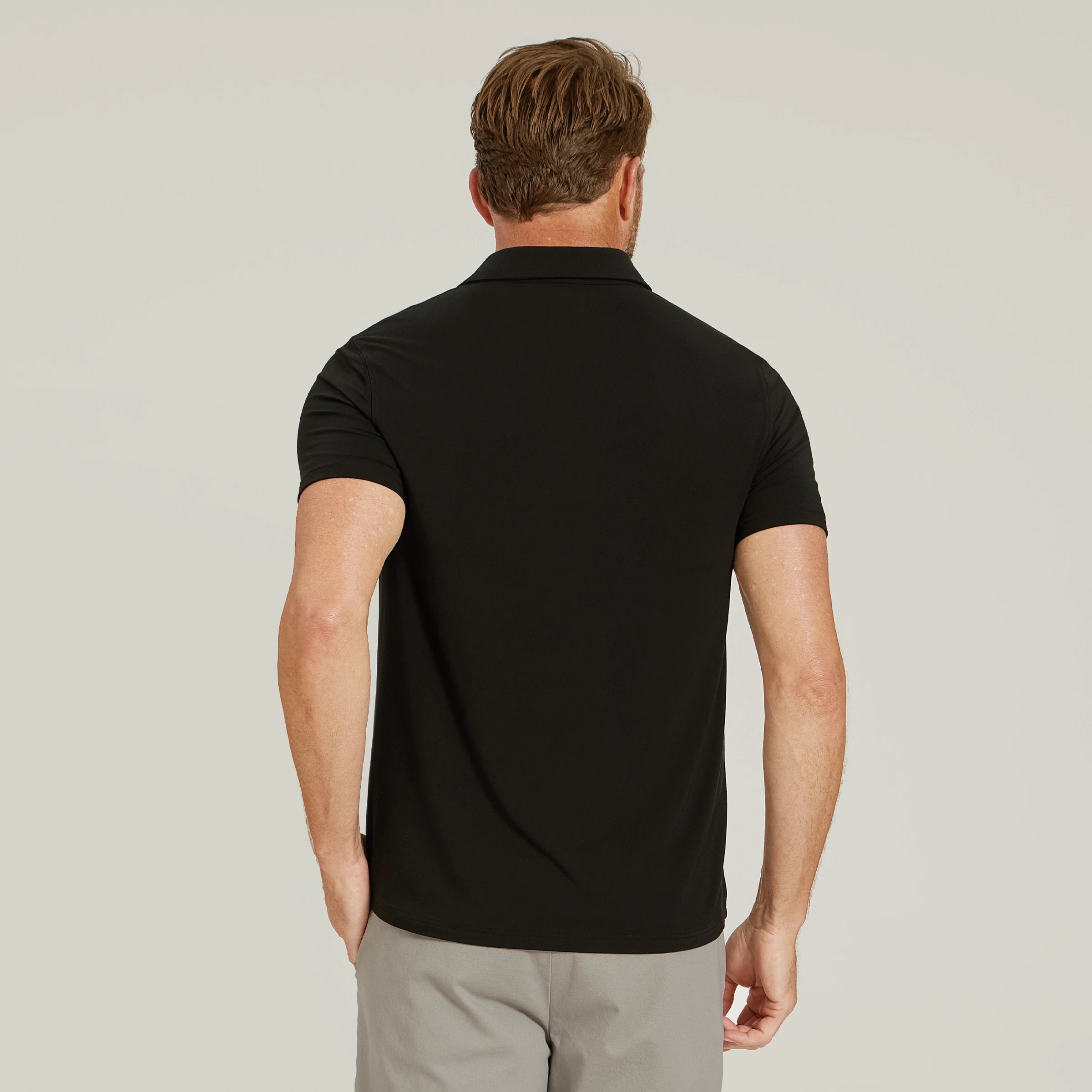 Men wearing Black Luxe Performance Polo